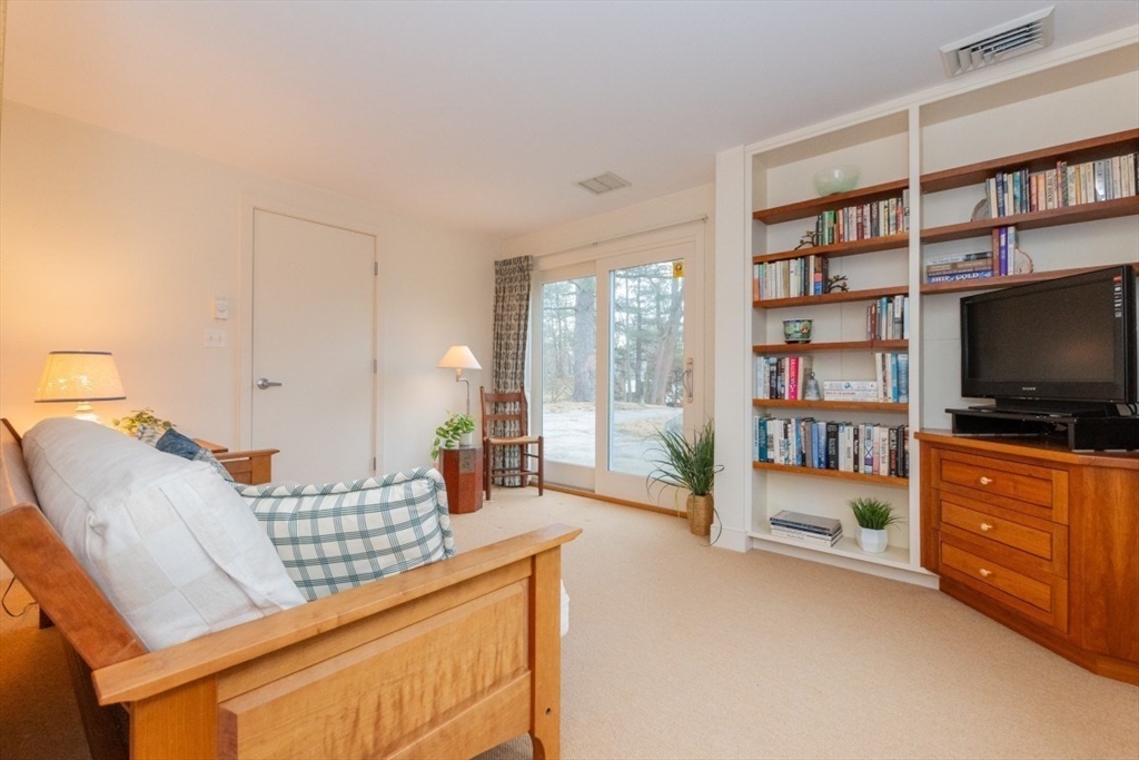 73 Valentine Street Newton, MA 02465 - Photo 16 of 26 a living room with furniture and a flat screen tv