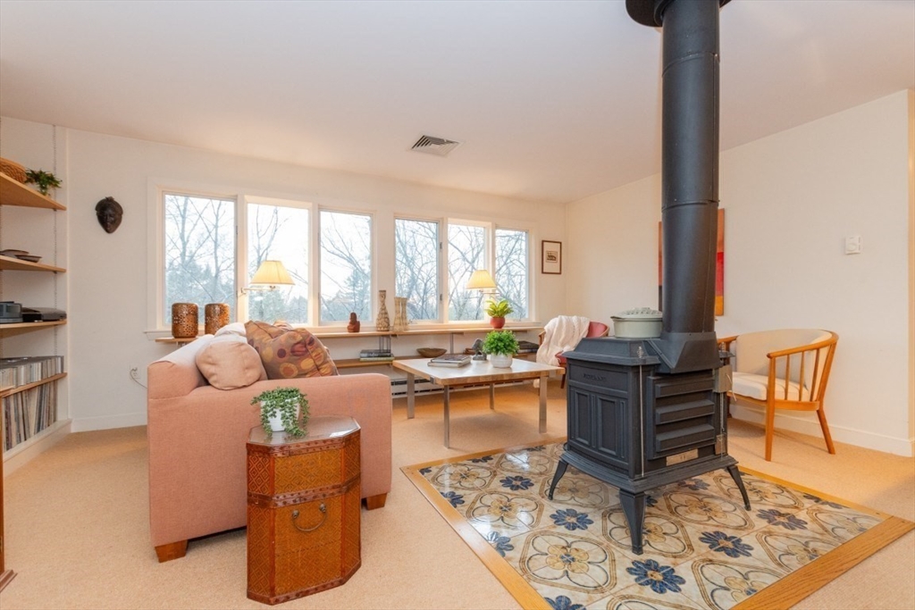 73 Valentine Street Newton, MA 02465 - Photo 2 of 26 a living room with furniture and a window