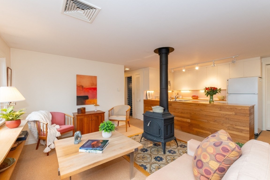 73 Valentine Street Newton, MA 02465 - Photo 3 of 26 a living room with furniture and a flat screen tv