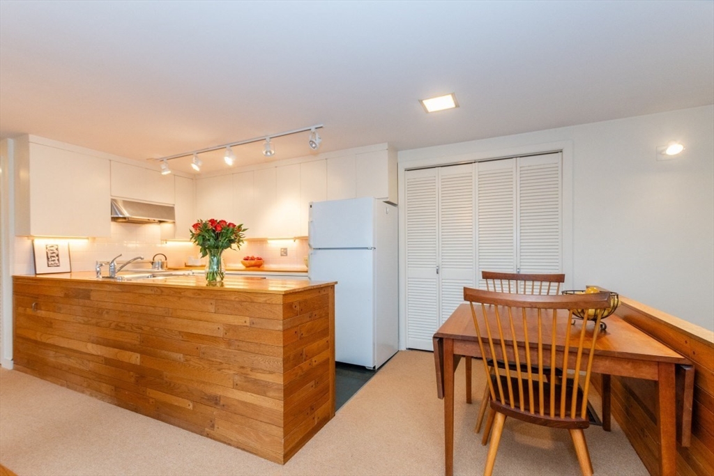 73 Valentine Street Newton, MA 02465 - Photo 6 of 26 a view of kitchen with furniture and refrigerator