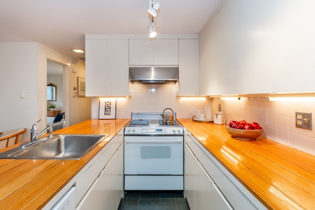 73 Valentine Street Newton, MA 02465 - Photo 8 of 26 a kitchen that has a sink and cabinets