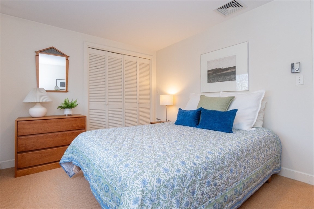 73 Valentine Street Newton, MA 02465 - Photo 10 of 26 a bedroom with a bed and window