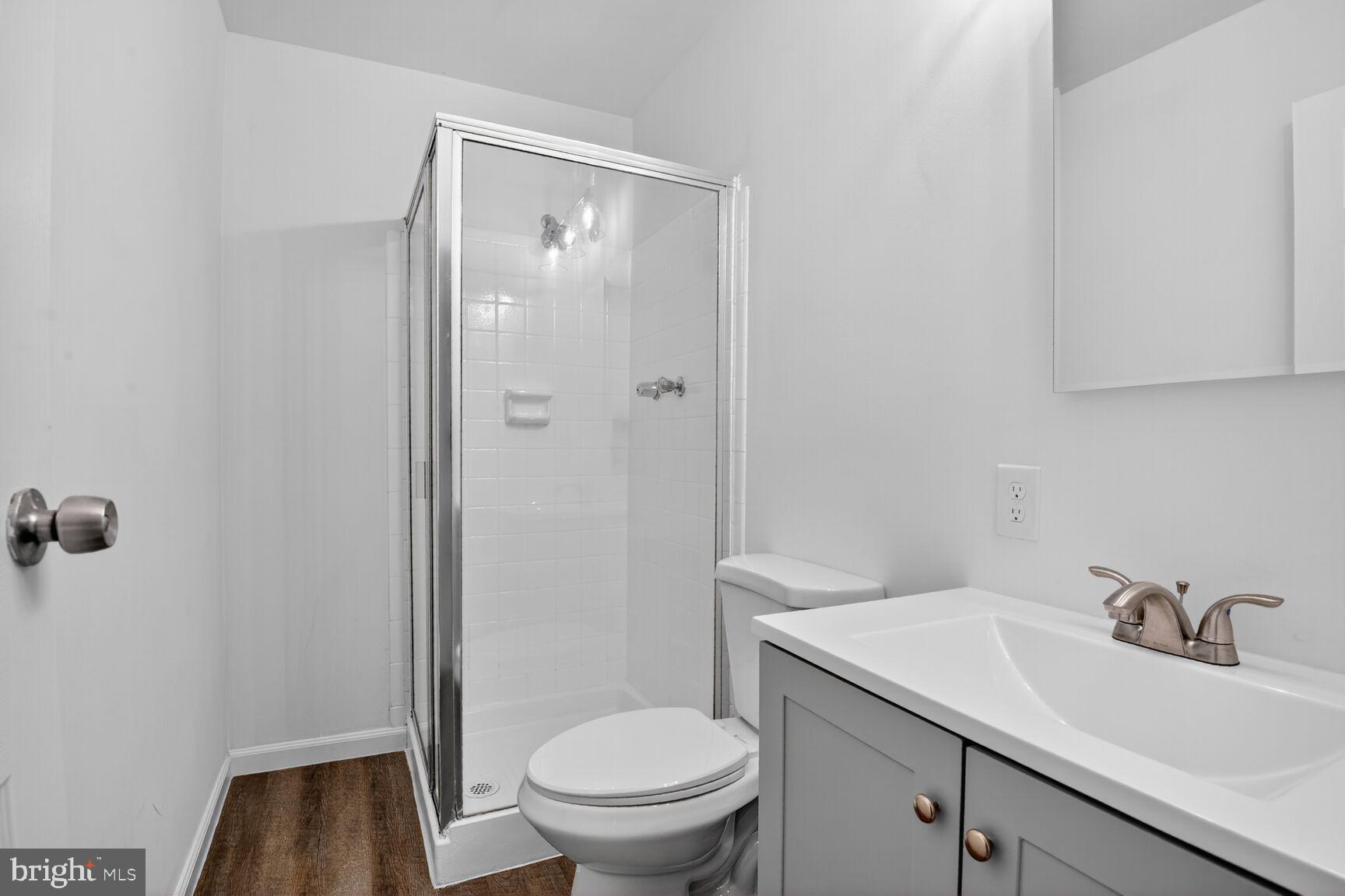 202 East Gordon Street Sterling, VA 20164 - Photo 14 of 20 a bathroom with a sink toilet and vanity