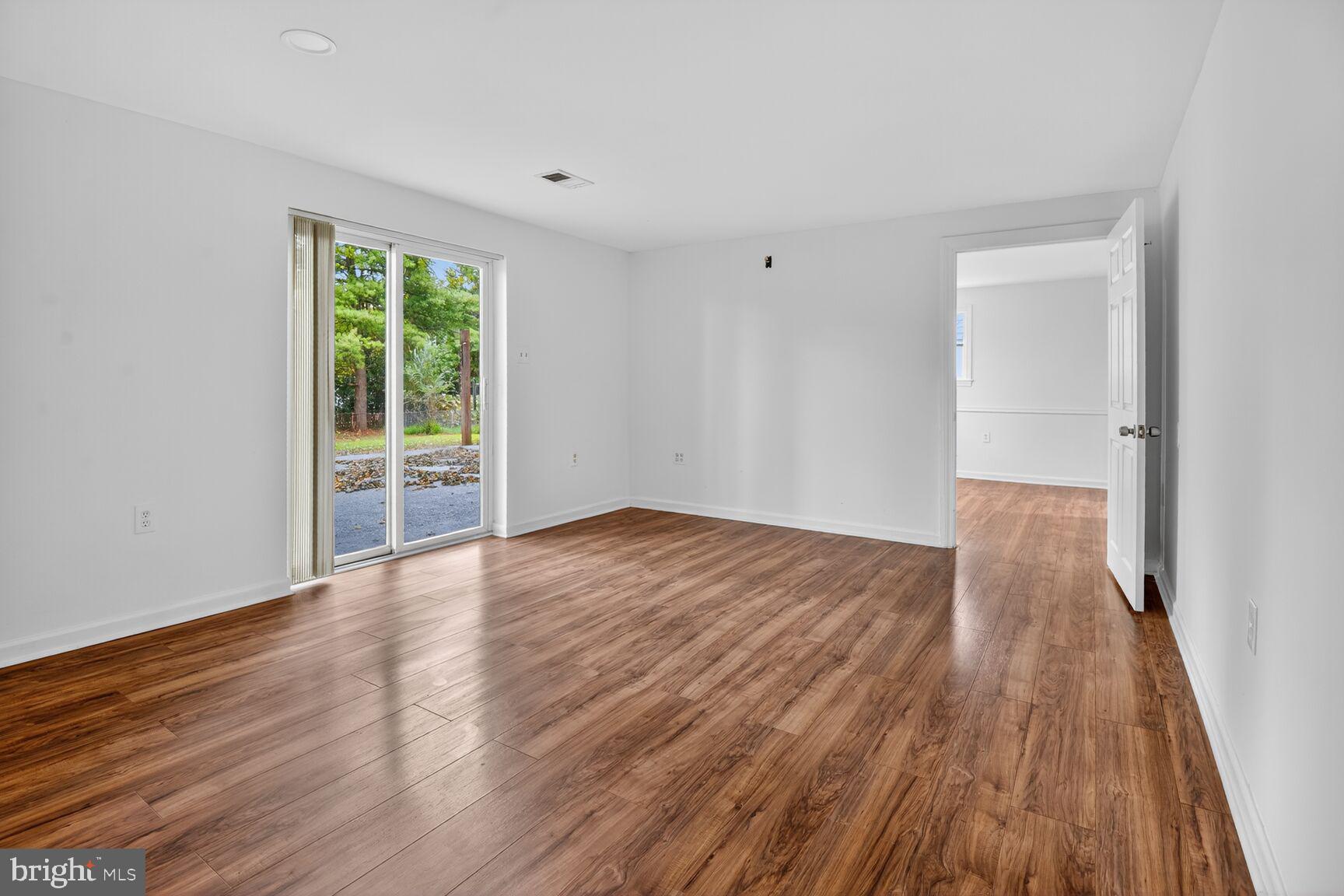 202 East Gordon Street Sterling, VA 20164 - Photo 17 of 20 a view of a room with wooden floor and window