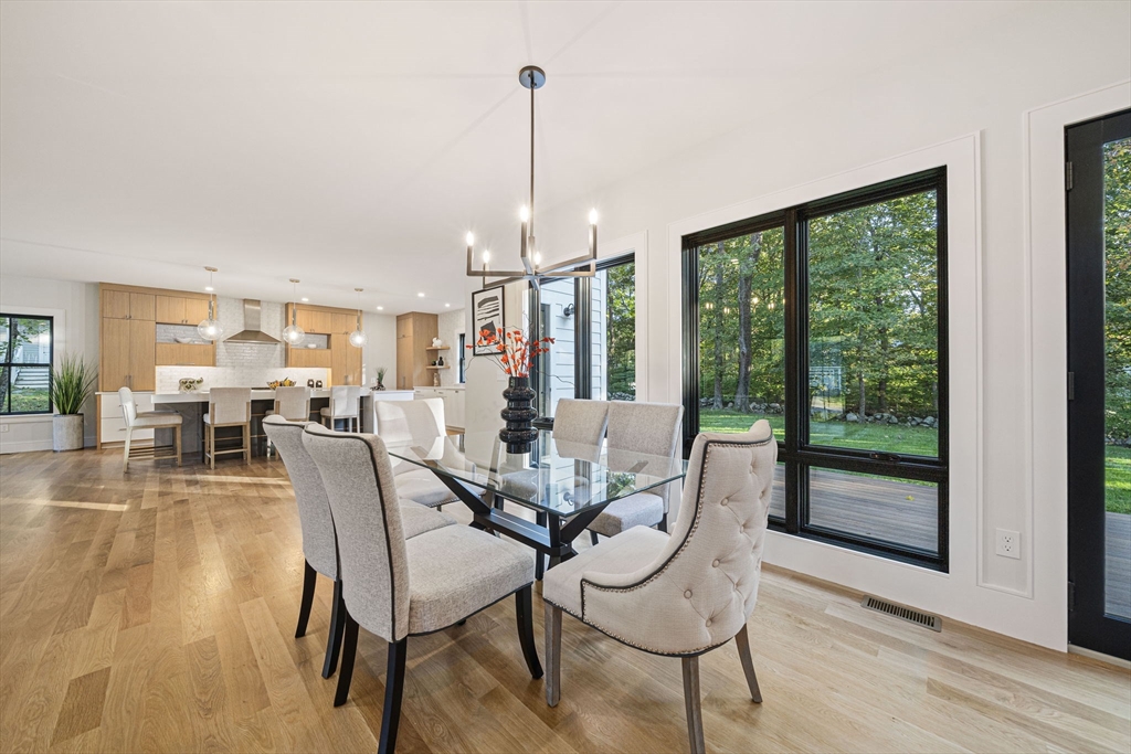7 Ashcroft Road Sharon, MA 02067 - Photo 12 of 36 a view of a dining room with furniture window and wooden floor