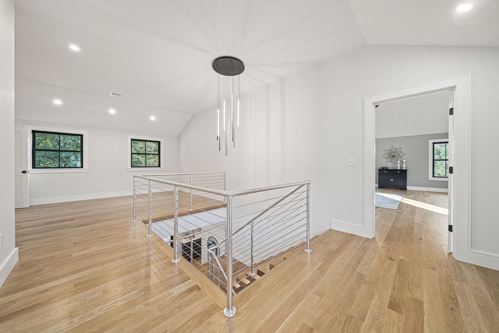 7 Ashcroft Road Sharon, MA 02067 - Photo 17 of 36 a view of a room with wooden floor and white walls