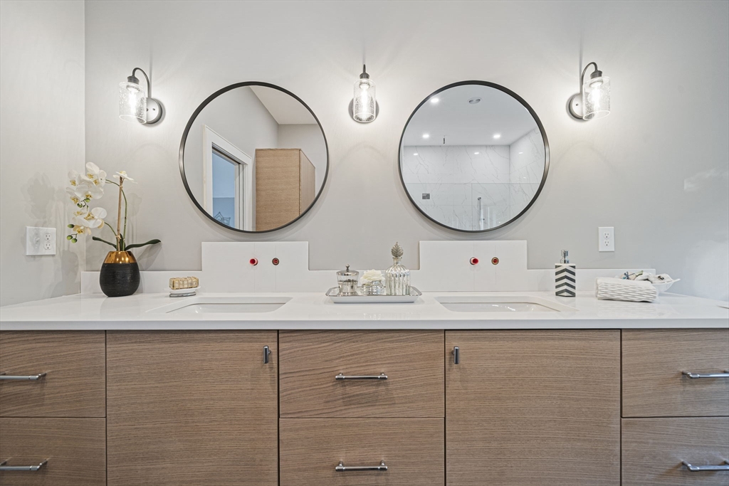7 Ashcroft Road Sharon, MA 02067 - Photo 23 of 36 a bathroom with a sink and a mirror