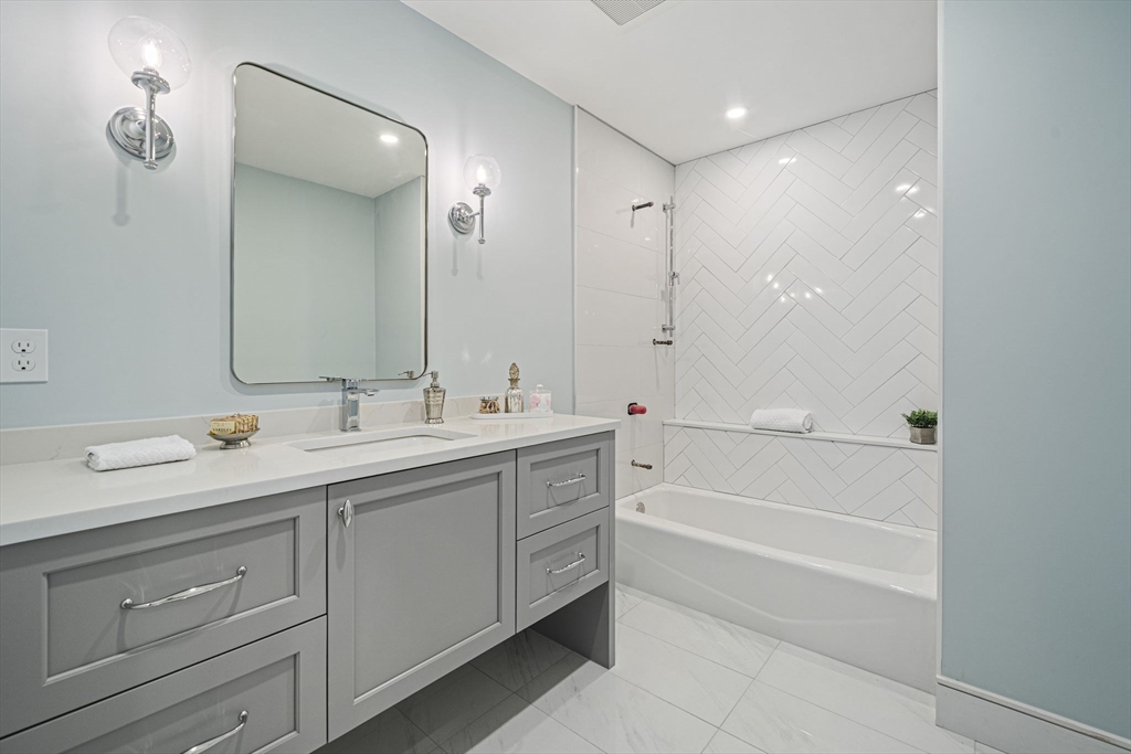 7 Ashcroft Road Sharon, MA 02067 - Photo 29 of 36 a bathroom with a tub a sink shower and mirror