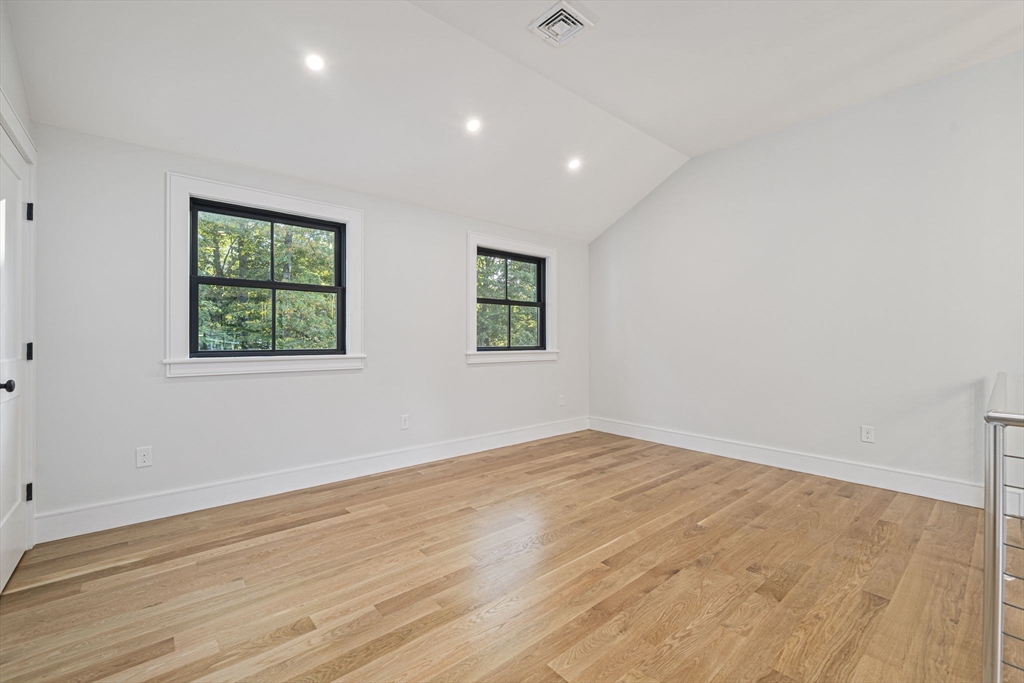 7 Ashcroft Road Sharon, MA 02067 - Photo 30 of 36 an empty room with wooden floor and windows