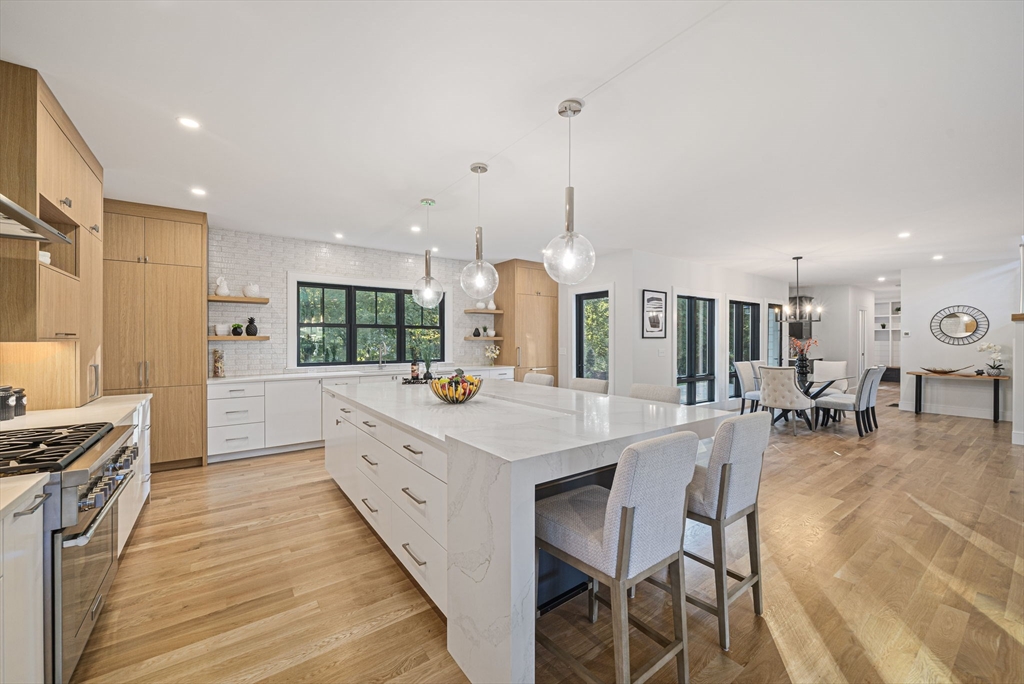 7 Ashcroft Road Sharon, MA 02067 - Photo 3 of 36 a large kitchen with a counter space a sink stainless steel appliances and cabinets