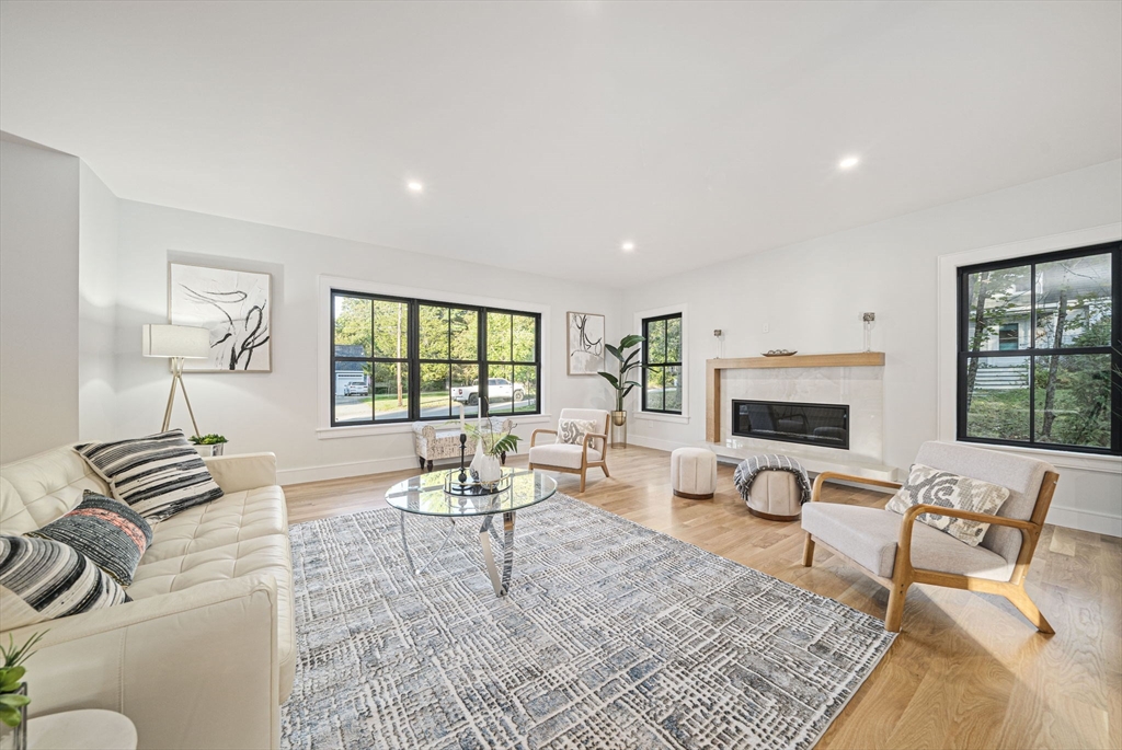 7 Ashcroft Road Sharon, MA 02067 - Photo 10 of 36 a living room with furniture and a fireplace
