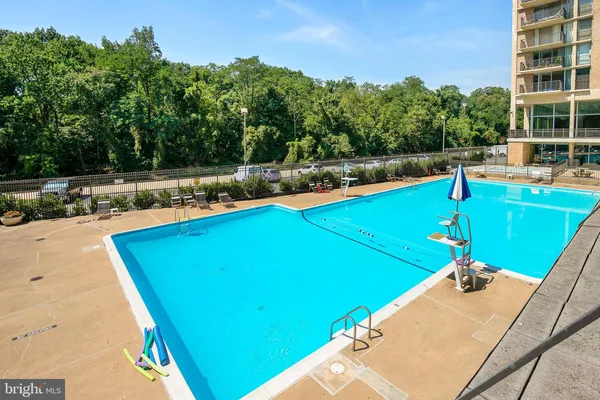 a view of a swimming pool with a yard