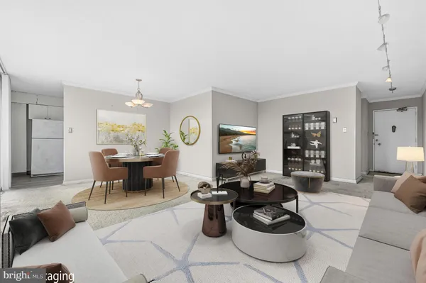 a living room with furniture a window and a clock