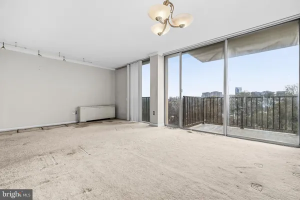 a view of an empty room with a balcony