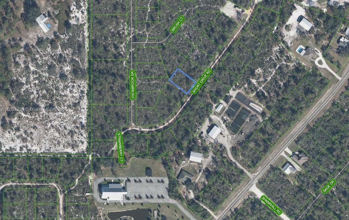 10323 Short Drive Sebring, FL 33875 - Photo 1 of 5 a aerial view of multiple house