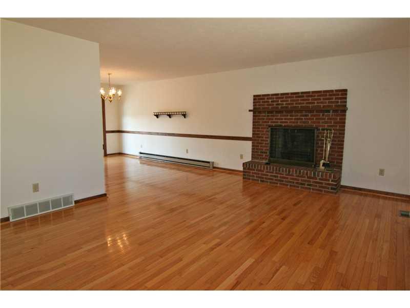 161 Deerfield Road Washington, PA 15301 - Photo 6 of 25 Living Room. Log-burning raised hearth fireplace adds charm and coziness!
