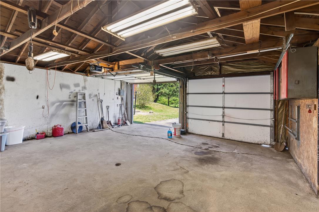 62 Stoney Road Tamaqua, PA 18252 - Photo 51 of 61 A well-lit garage provides practical storage and easy access with its wide door.