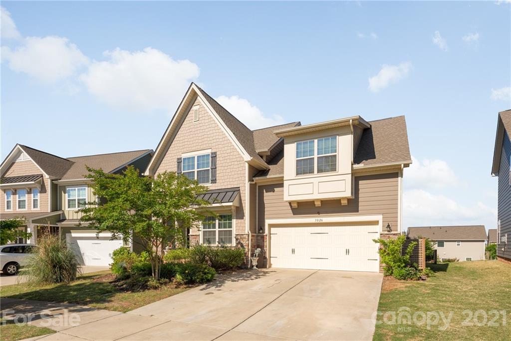 3026 Oakmere Road Waxhaw, NC 28173 - Photo 2 of 27 a front view of a house with garden