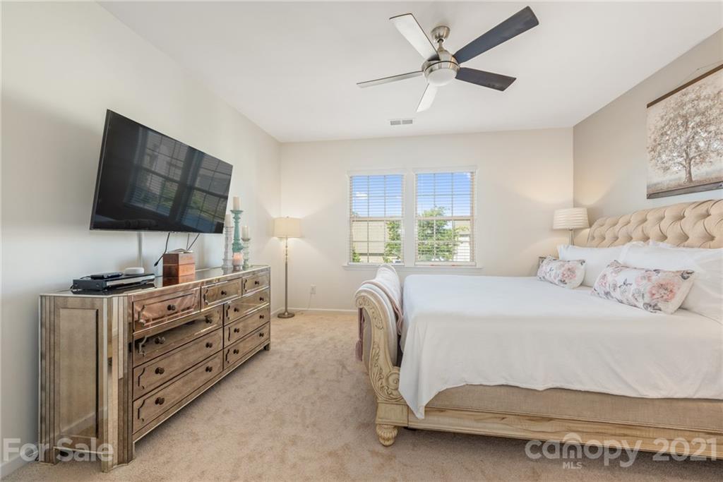 3026 Oakmere Road Waxhaw, NC 28173 - Photo 12 of 27 a bedroom with a bed and a flat screen tv