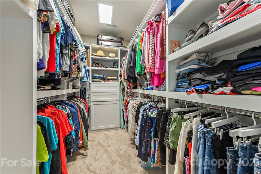 3026 Oakmere Road Waxhaw, NC 28173 - Photo 15 of 27 a view of walk in closet with clothes