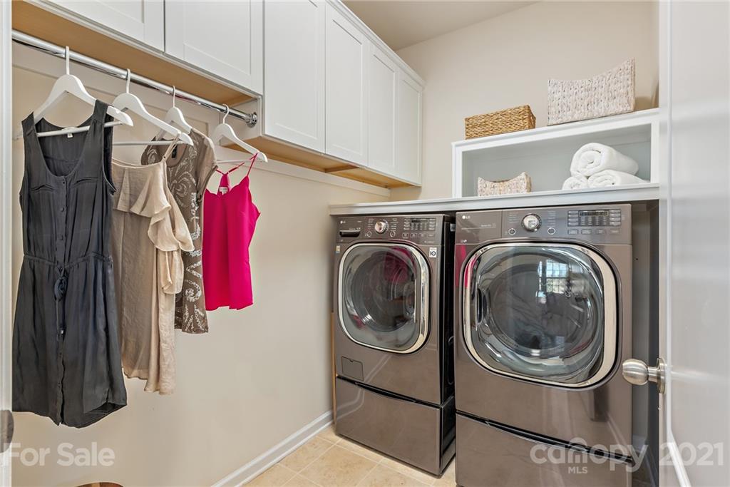 3026 Oakmere Road Waxhaw, NC 28173 - Photo 24 of 27 a utility room with dryer and washer