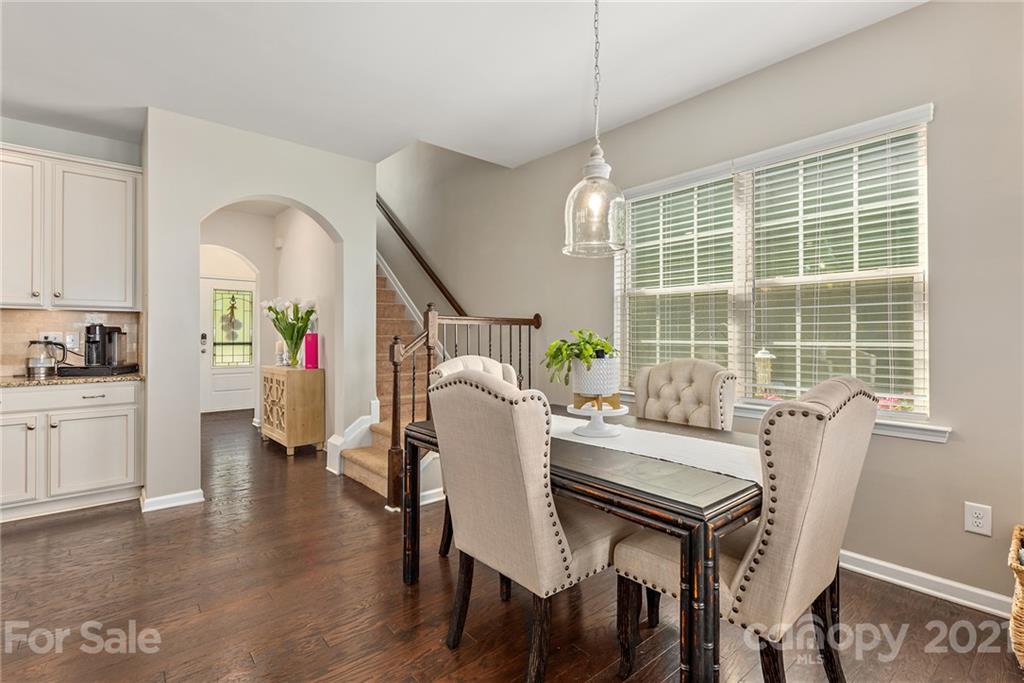 3026 Oakmere Road Waxhaw, NC 28173 - Photo 6 of 27 a view of a dining room with furniture window and wooden floor
