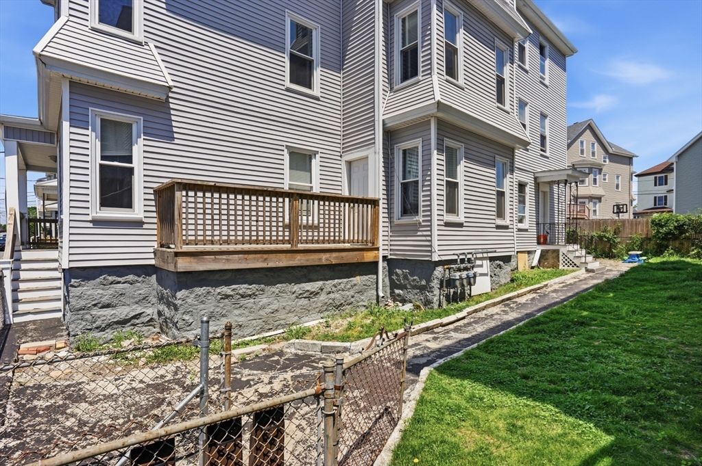 196 Irving Street Fall River, MA 02723 - Photo 34 of 34 a front view of a house with a yard