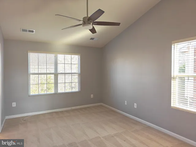 a bathroom with a bathtub sink and a mirror