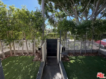 a living room with furniture wooden floor and a flat screen tv