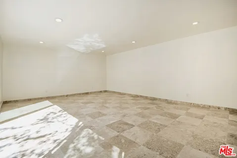 a view of a dining hall with furniture and wooden floor