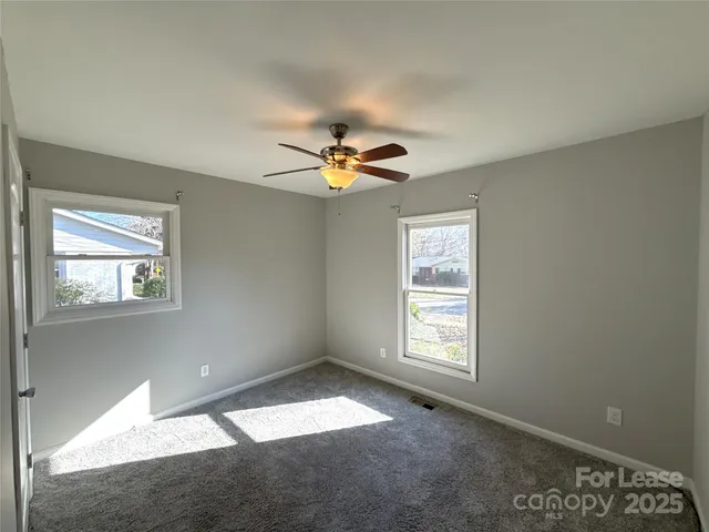 a view of empty room with windows