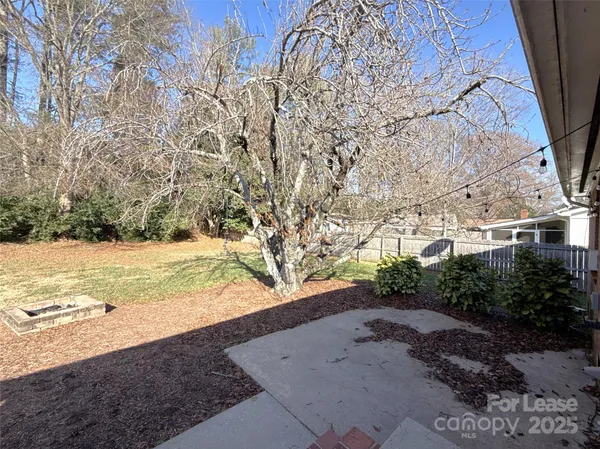 a view of an outdoor space with wooden floor