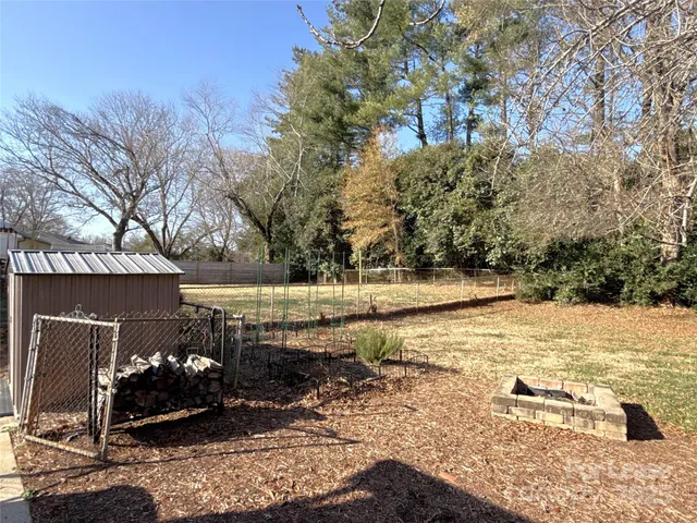 a view of a backyard of the house