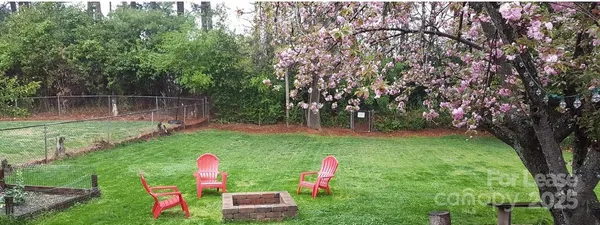 a backyard of a house with lots of green space