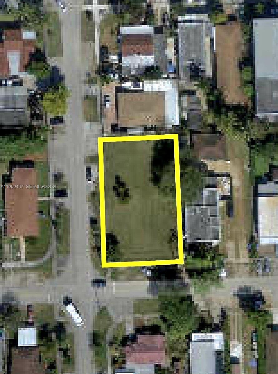 2397 Northwest 34th Street Miami, FL 33142 - Photo 9 of 11 an aerial view of a house with a yard and lake view