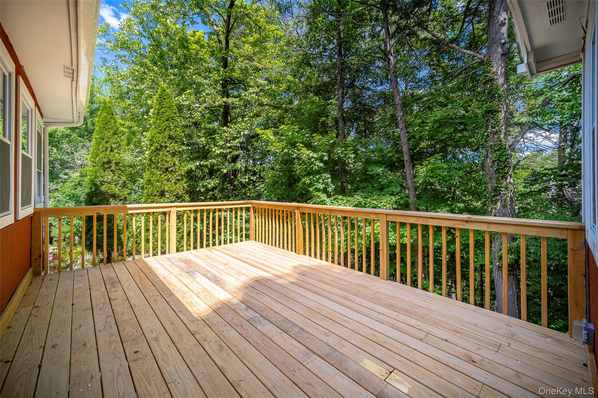 219 Benedict Road Montgomery, NY 12549 - Photo 37 of 50 a balcony with wooden floor and trees