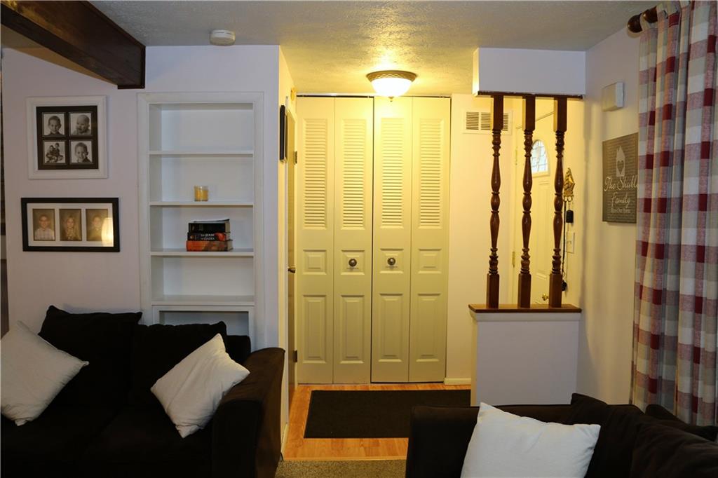 219 Shady Ridge Drive Monroeville, PA 15146 - Photo 3 of 23 Level entry way with large coat closet and half bath; built-in shelving in living room