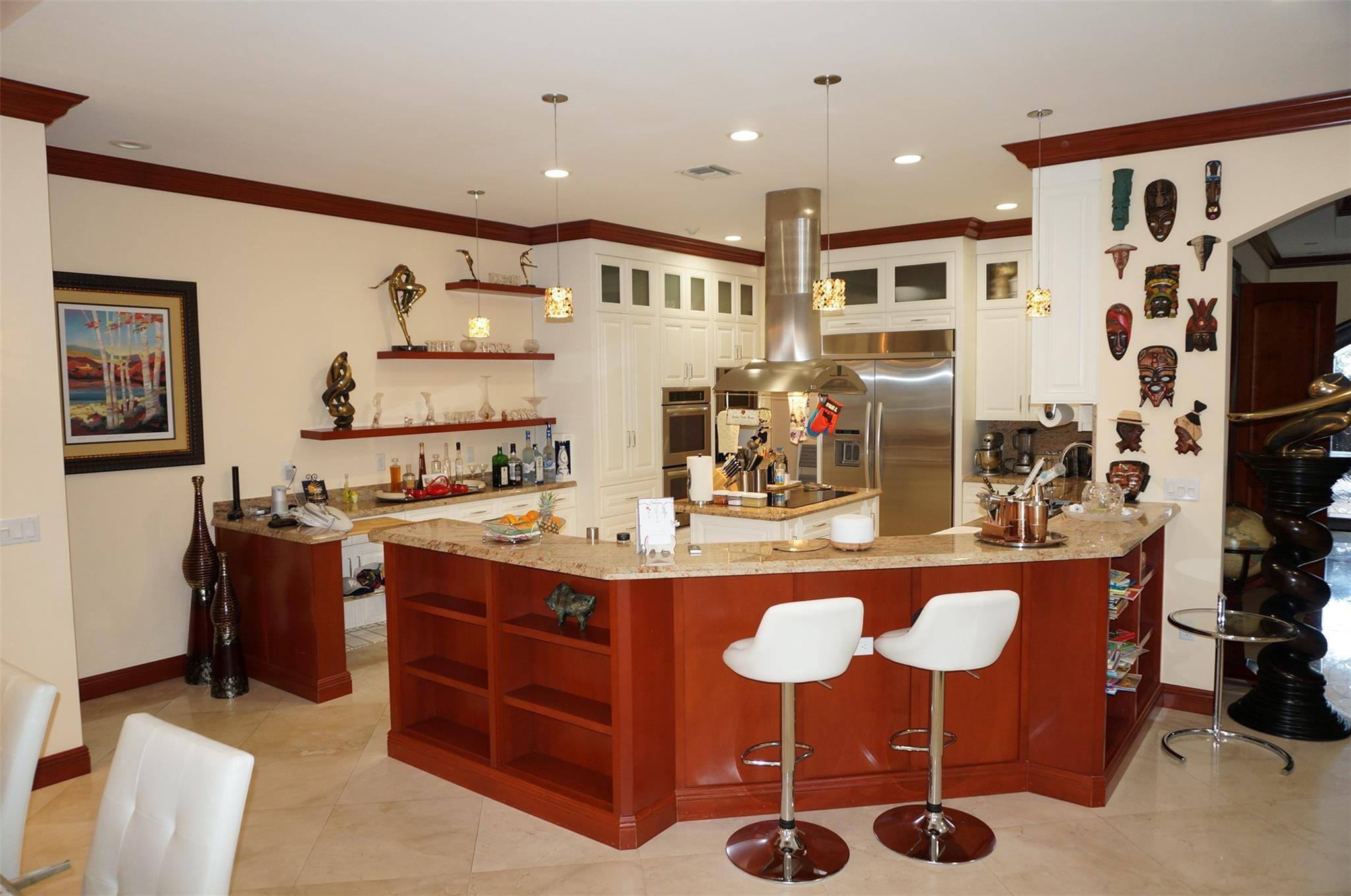 650 East Rambling Drive Wellington, FL 33414 - Photo 12 of 75 a kitchen with stainless steel appliances granite countertop a sink and a refrigerator