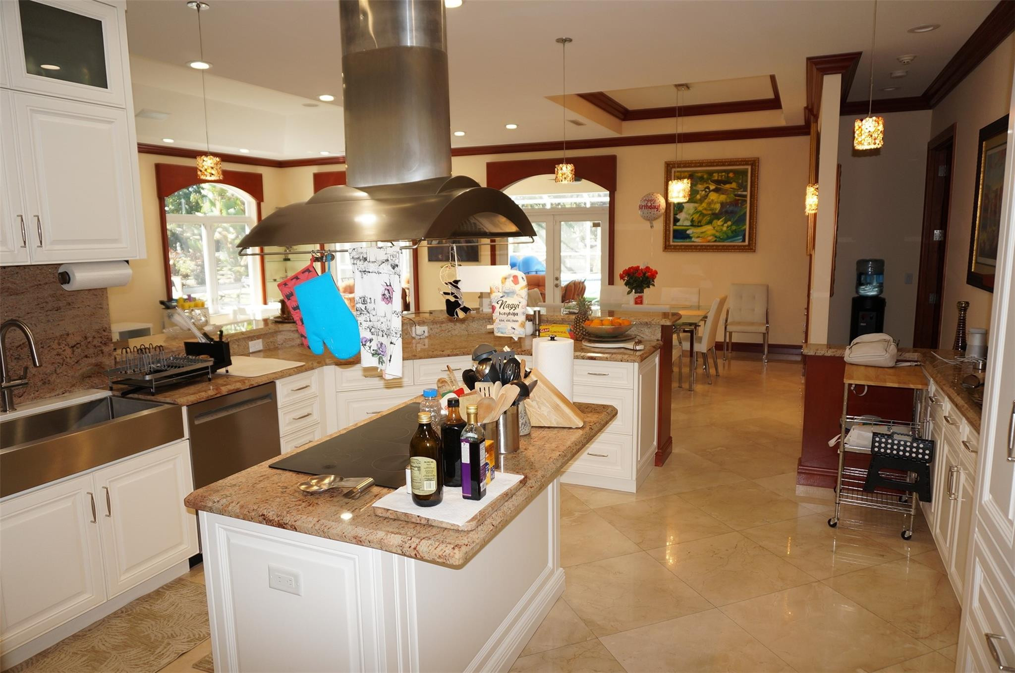 650 East Rambling Drive Wellington, FL 33414 - Photo 17 of 75 a kitchen with stainless steel appliances granite countertop a sink and a stove