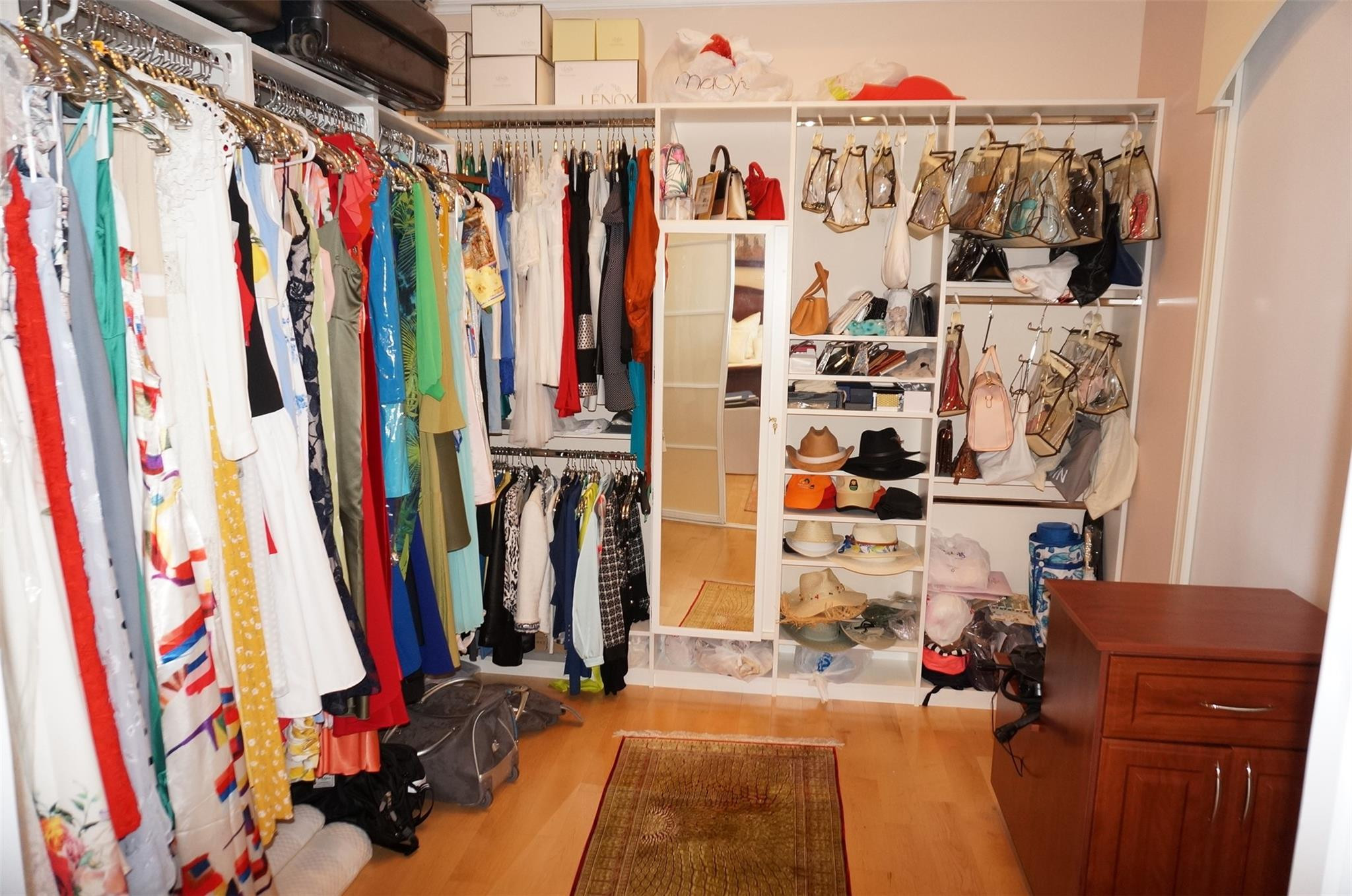 650 East Rambling Drive Wellington, FL 33414 - Photo 28 of 75 a view of walk in closet with clothes and shoes