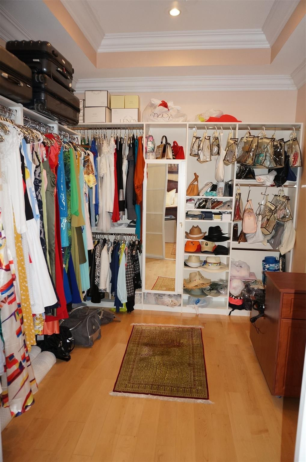 650 East Rambling Drive Wellington, FL 33414 - Photo 29 of 75 a view of walk in closet with clothes and shoes