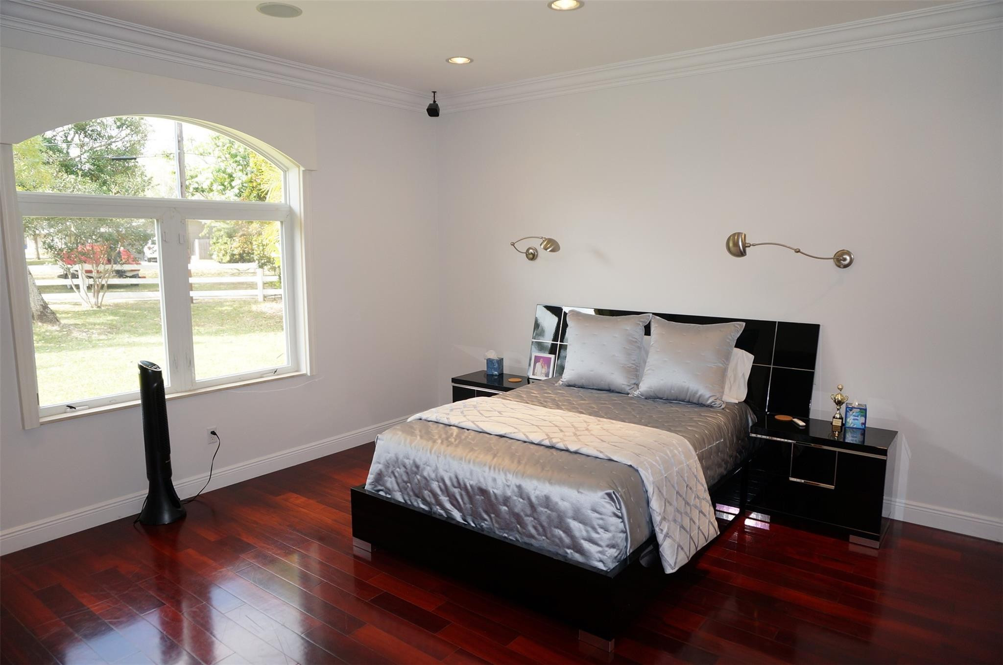 650 East Rambling Drive Wellington, FL 33414 - Photo 30 of 75 a bedroom with a bed and a large window