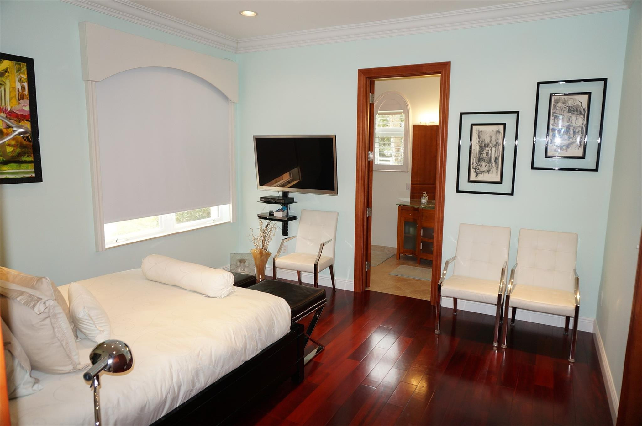 650 East Rambling Drive Wellington, FL 33414 - Photo 38 of 75 a bedroom with a bed and wooden floor