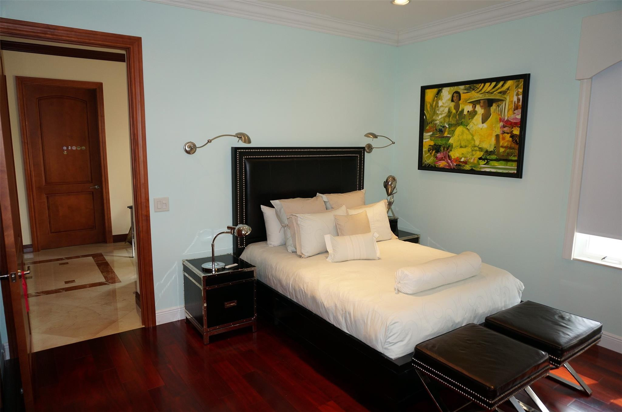 650 East Rambling Drive Wellington, FL 33414 - Photo 39 of 75 a bedroom with a bed and wooden floor