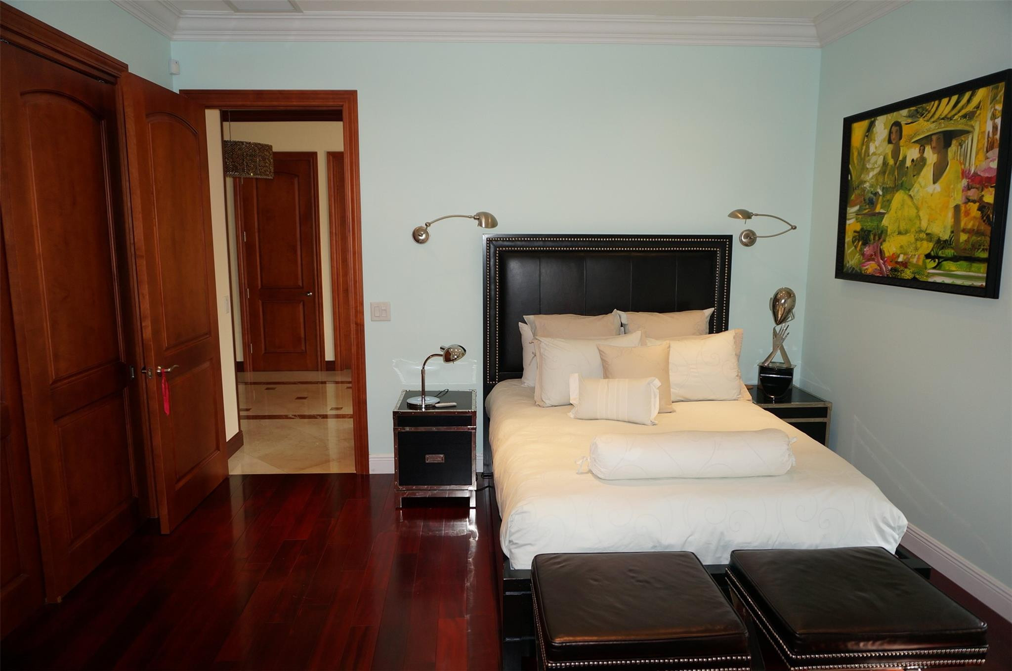 650 East Rambling Drive Wellington, FL 33414 - Photo 40 of 75 a bedroom with a bed and wooden floor
