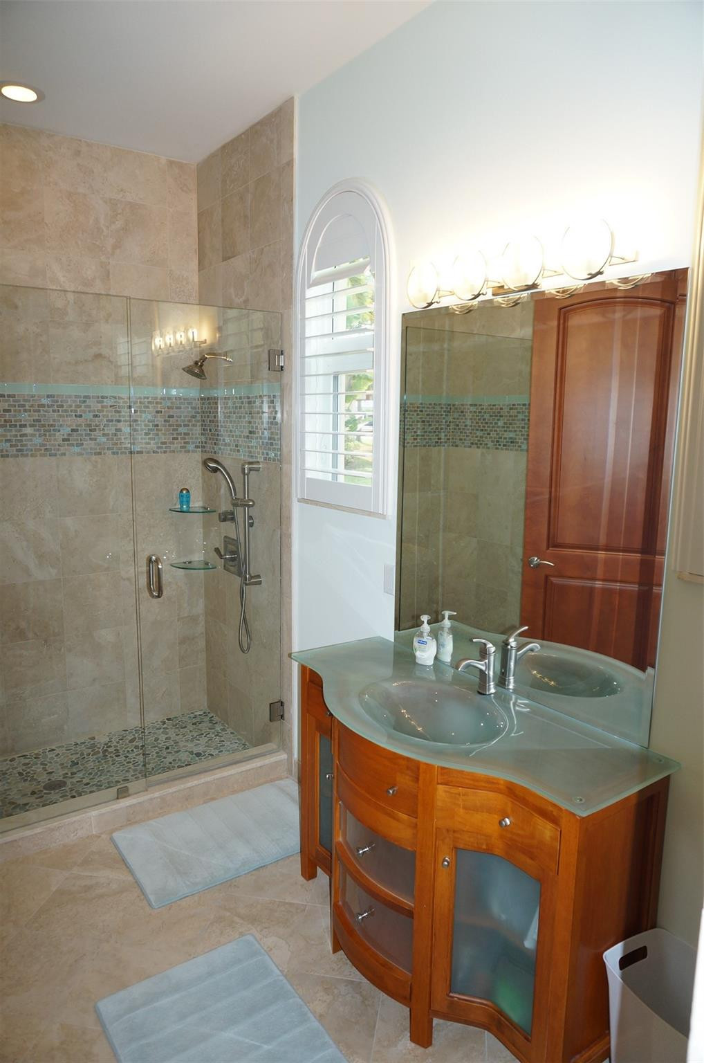 650 East Rambling Drive Wellington, FL 33414 - Photo 41 of 75 a bathroom with a granite countertop sink a mirror and shower