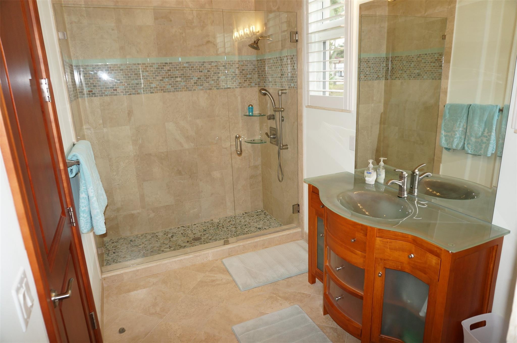 650 East Rambling Drive Wellington, FL 33414 - Photo 42 of 75 a bathroom with a granite countertop sink a mirror a bathtub and shower