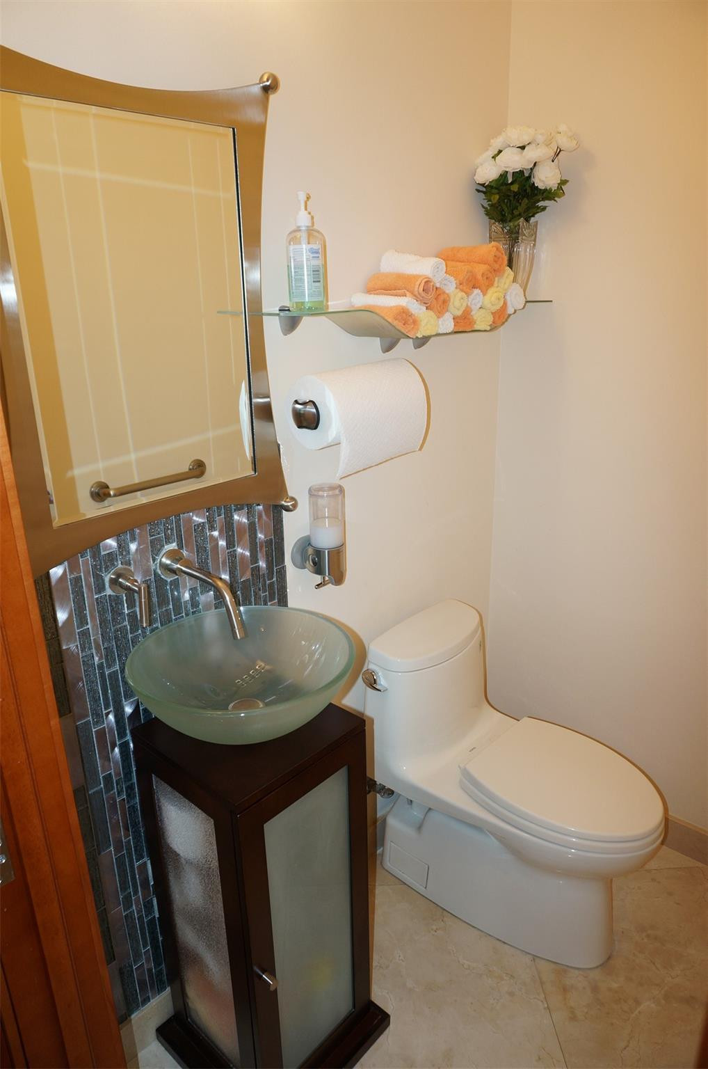 650 East Rambling Drive Wellington, FL 33414 - Photo 46 of 75 a bathroom with a toilet sink and mirror