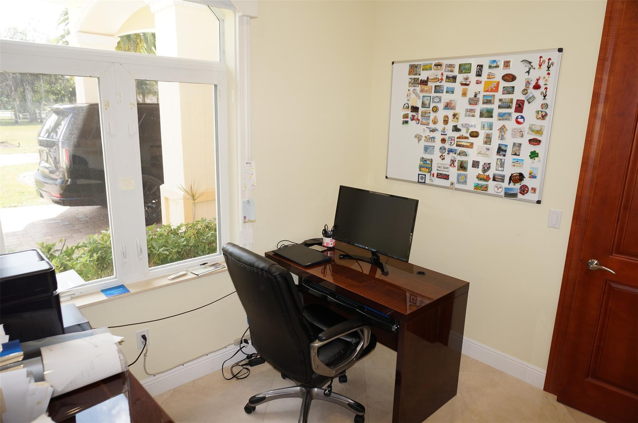 650 East Rambling Drive Wellington, FL 33414 - Photo 50 of 75 a view of a workspace with furniture and a window