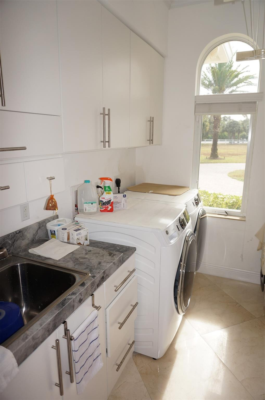 650 East Rambling Drive Wellington, FL 33414 - Photo 53 of 75 a utility room with sink dryer and washer